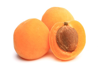 apricot cut in half on white background