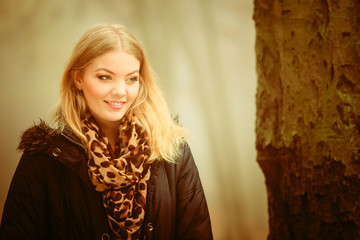 Fototapeta premium Woman walking in park in foggy day