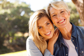 middle aged blond mother and adult daughter - obrazy, fototapety, plakaty