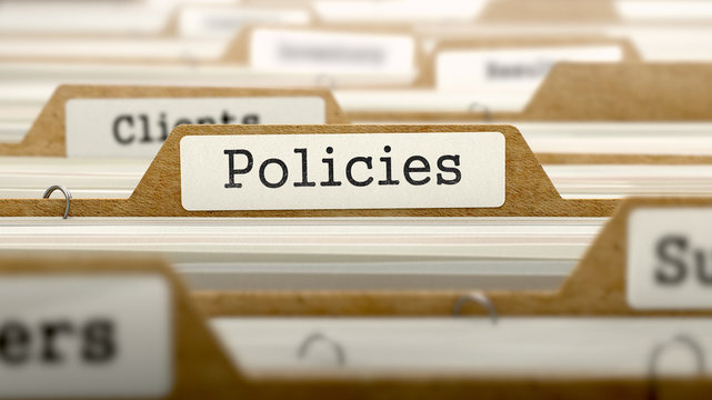Policies Concept with Word on Folder.