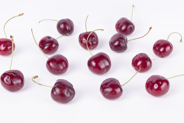 Obraz na płótnie Canvas Delicious Red cherry / cherries (white studio background)