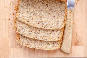 Sliced wholemeal bread on cutting board