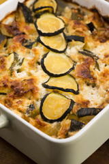 casserole with cheese and zucchini in baking dish