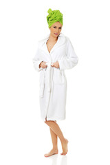 Spa woman in bathrobe and turban.