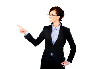 Businesswoman pointing up.