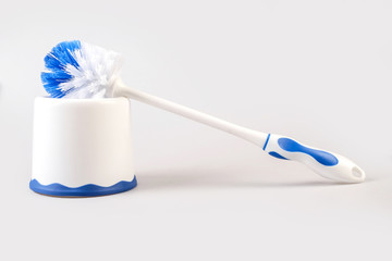 Plastic blue toilet brush isolated on white background..