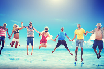 Obraz premium Diverse Beach Summer Friends Fun Jump Shot Concept