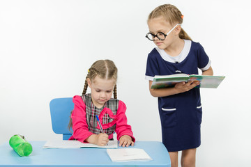 Girl student teacher dictating dictation