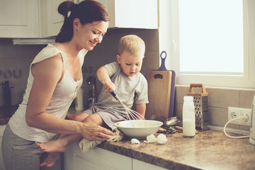 Mother with child cooking together