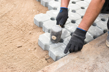 Worker Building Concrete Bricked Floor