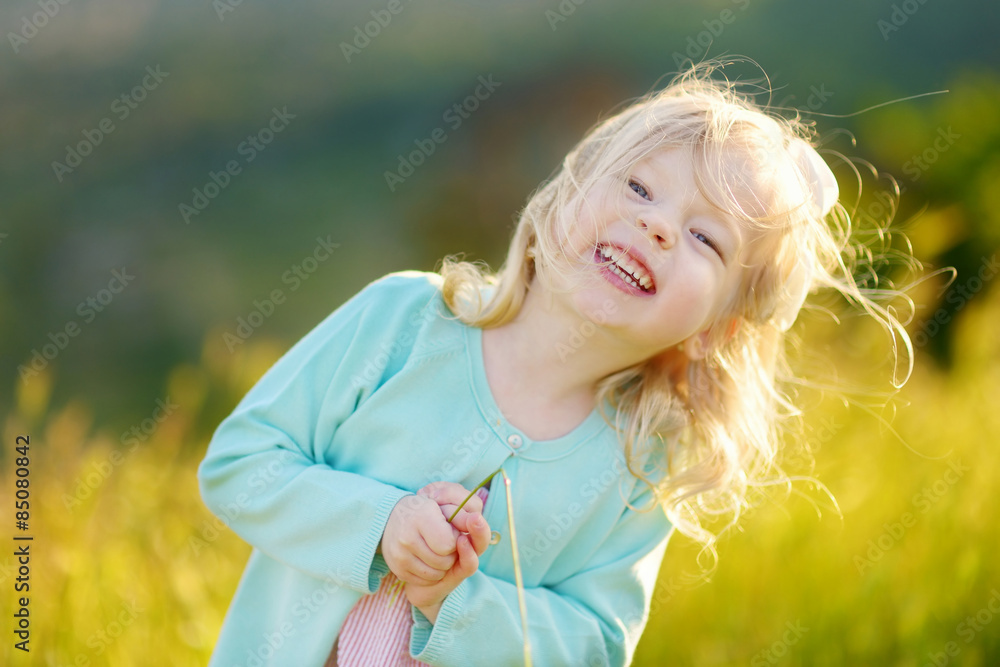 Wall mural adorable toddler girl on summer day