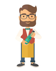 Wine maker holding a bottle of wine.