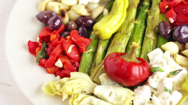 Appetizers plate with vegetarian antipasto in Italian restaurant.