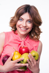 Smiling beautiful woman holding fruits