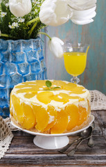 Party table with peach cheese cake