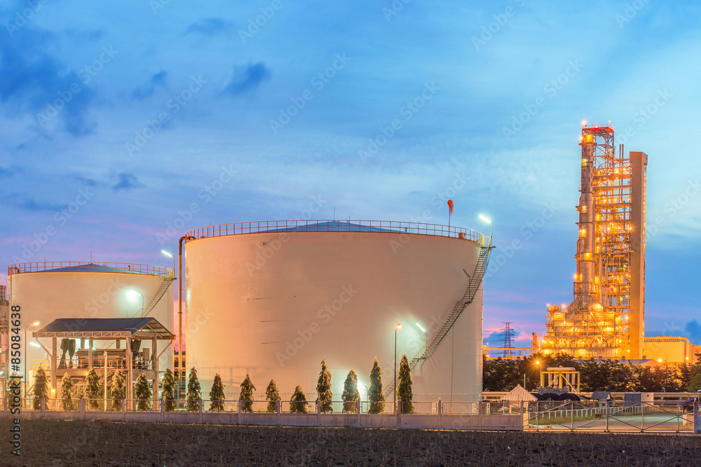 Wall mural panorama of oil refinery and storage tanks at twilight