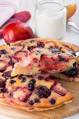 Clafoutis with plum and blackberry.