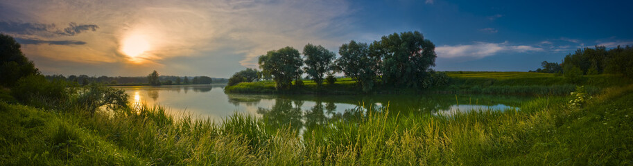 Panoramic view of the sunset over the lake