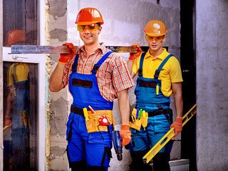 Group people in builder uniform.