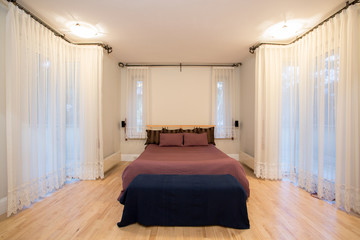 Huge window in cozy bedroom