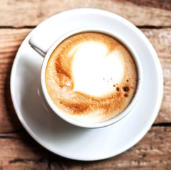 Cup of Coffee for breakfast on rustic wooden table, top view. Ca