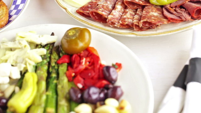 Appetizers plate with vegetarian antipasto in Italian restaurant.