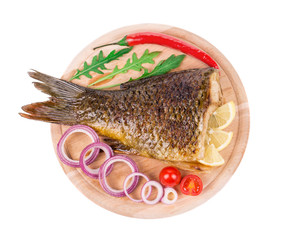 Fried carp tail with lemon and pepper.