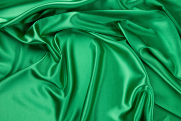 Green silk cloth with soft folds.