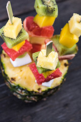 Healthy party snack, exotic fruits on skewers