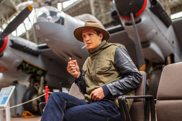 Male in casual clothing siting on chair