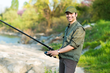 Fisherman fishing on a river