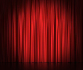 Red silk curtains for theater and cinema spotlit light in the