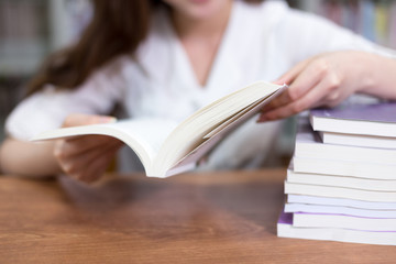 Beautiful asian female student portrait and books in library wit