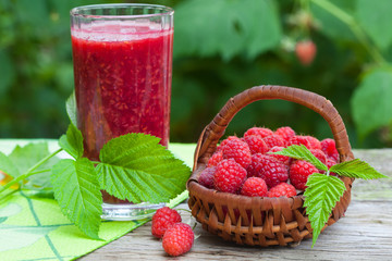 Raspberry healthy smoothie drink on wooden background