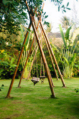 Fototapeta premium Green place with bamboo swings