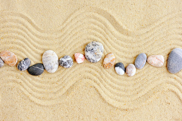 Striped stones on the sand,can be used as background