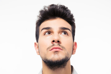 Fototapeta premium Closeup portait of a man looking up at copyspace