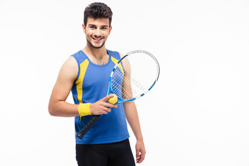 Cheerful man holding tennis racket and ball