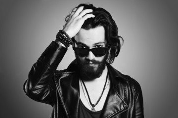 monochrome portrait of handsome man.bearded boy in sunglasses