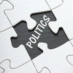 The word Politics revealed by a missing jigsaw puzzle pieces