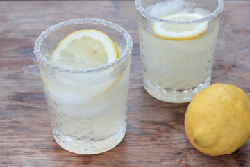 Glass of freshly prepared, cold and refreshing lemonade.