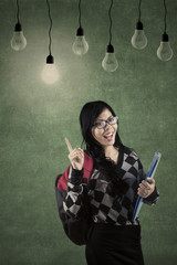 High school student with lamps in class