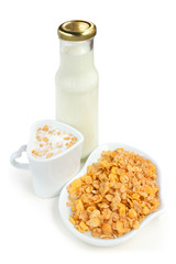 Bottle of milk and cereal in a heart cup.