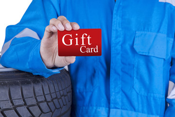 Mechanic presenting a gift card