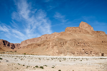 Fototapeta na wymiar Sarhro Jbel mountains. Photography of a track near the mountain Jbel Jarhro, Tata, Atlas Mountains, Morocco.