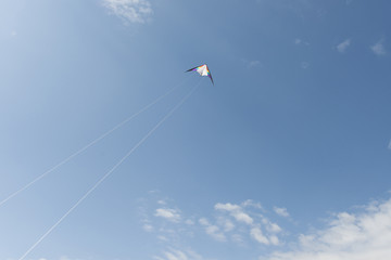 Man flying a kite on the beach.