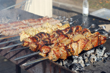 Grilled meat and sausages over the coals
