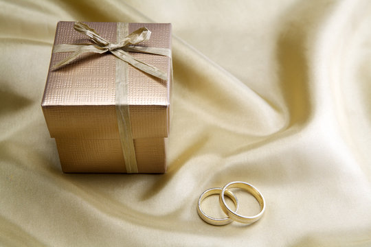 Wedding rings  on golden silk