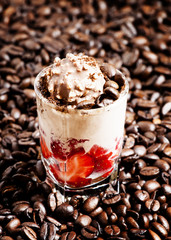 Coffee and chocolate dessert with ice cream and strawberries, se