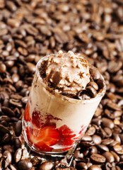 Coffee and chocolate dessert with ice cream and strawberries, se